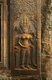 Cambodia: Apsaras (Celestial Nymph) adorn the eastern entrance to Angkor Wat, seen here at sunrise